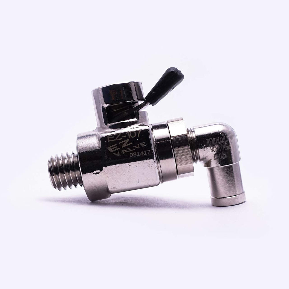 EZ Oil Drain Valve installed under vehicle directing oil to catch pan for cleaner work
