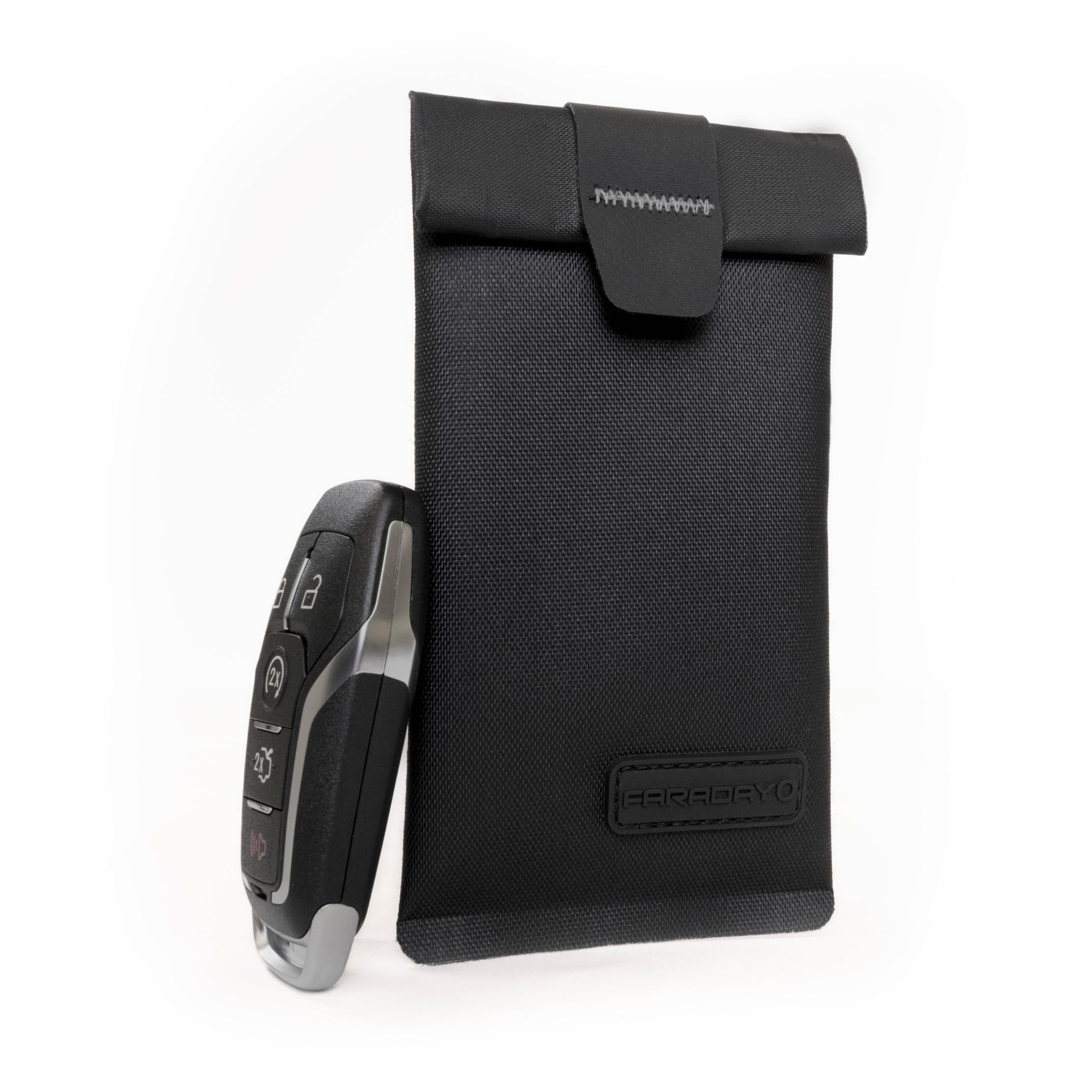 Faraday Defense stored in a car glovebox offering vehicle theft protection benefit