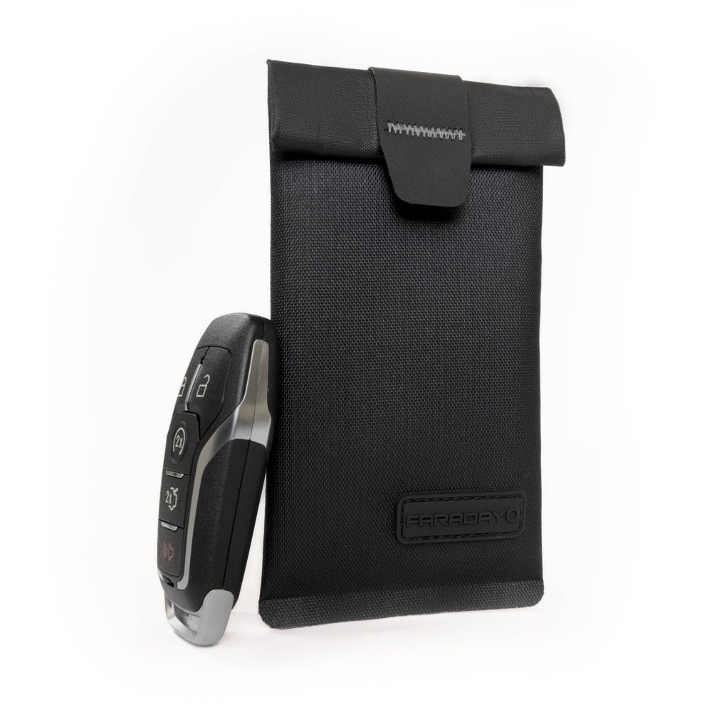 Faraday Defense stored in a car glovebox offering vehicle theft protection benefit