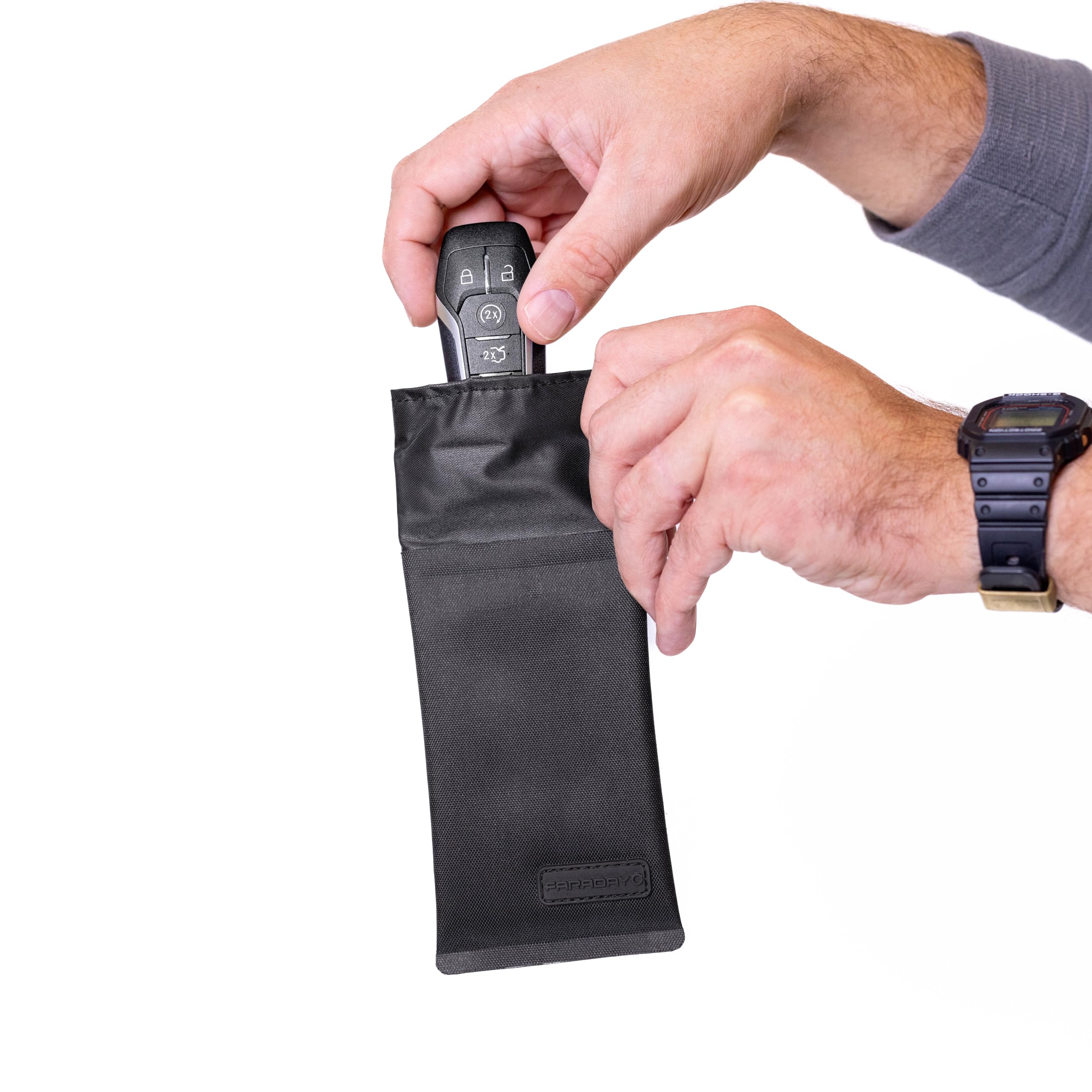 Faraday Defense next to keys and cards to show size and capacity benefit