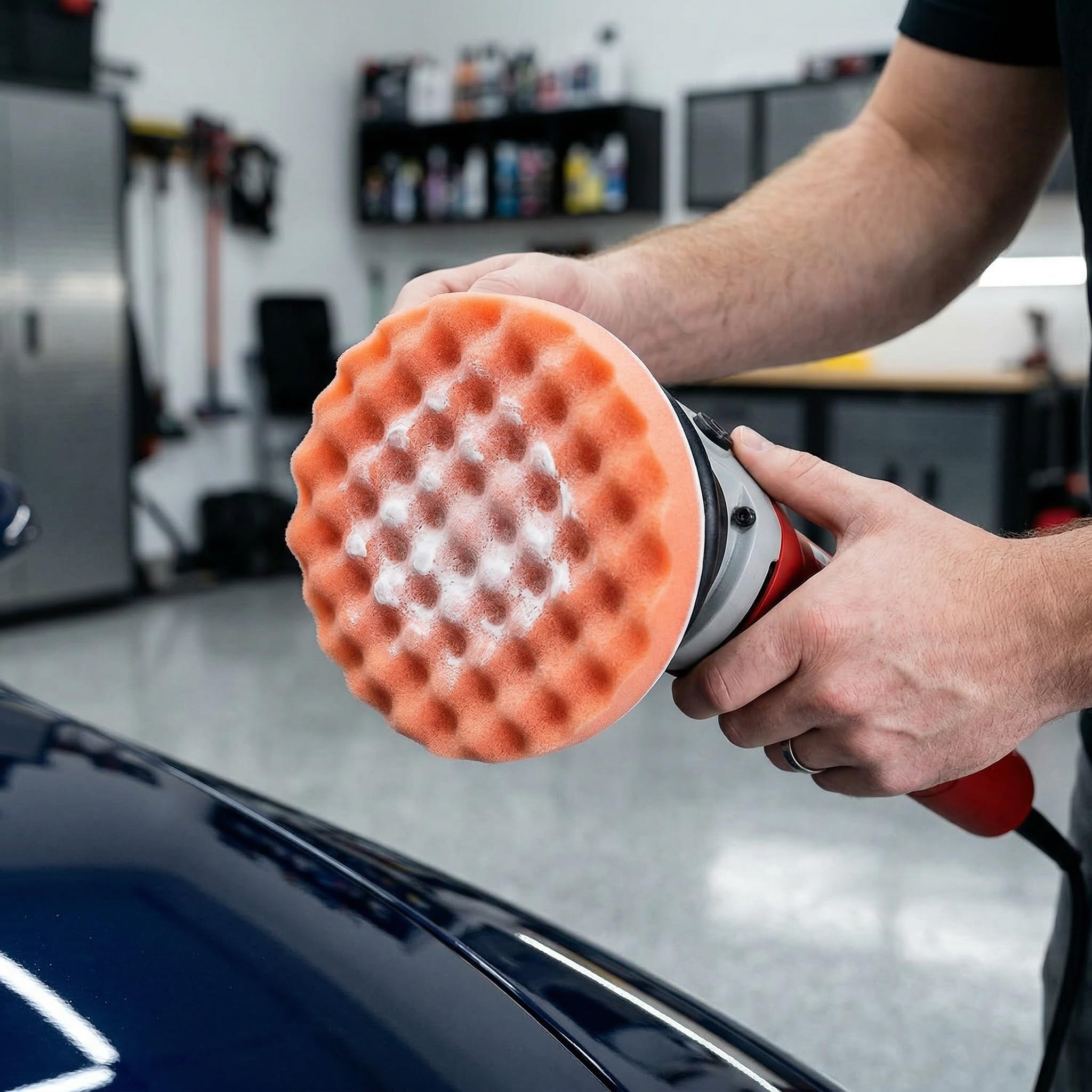Fasmov pad in use on car hood showing controlled polishing and reduced sling