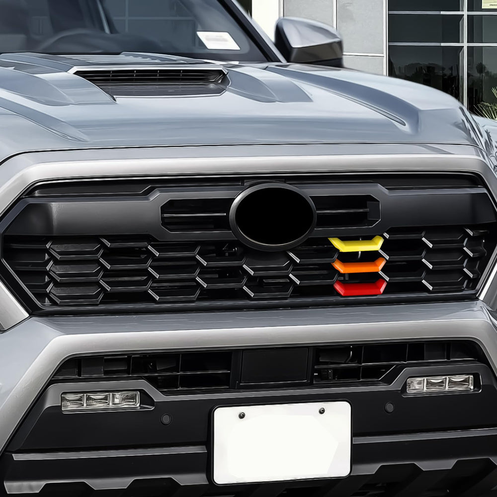 FEXIDA badge installed close with scale reference showing compact, precise sizing