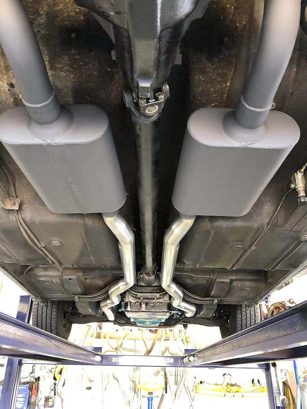 Floshine muffler next to ruler showing 13" body and overall length for sizing benefit