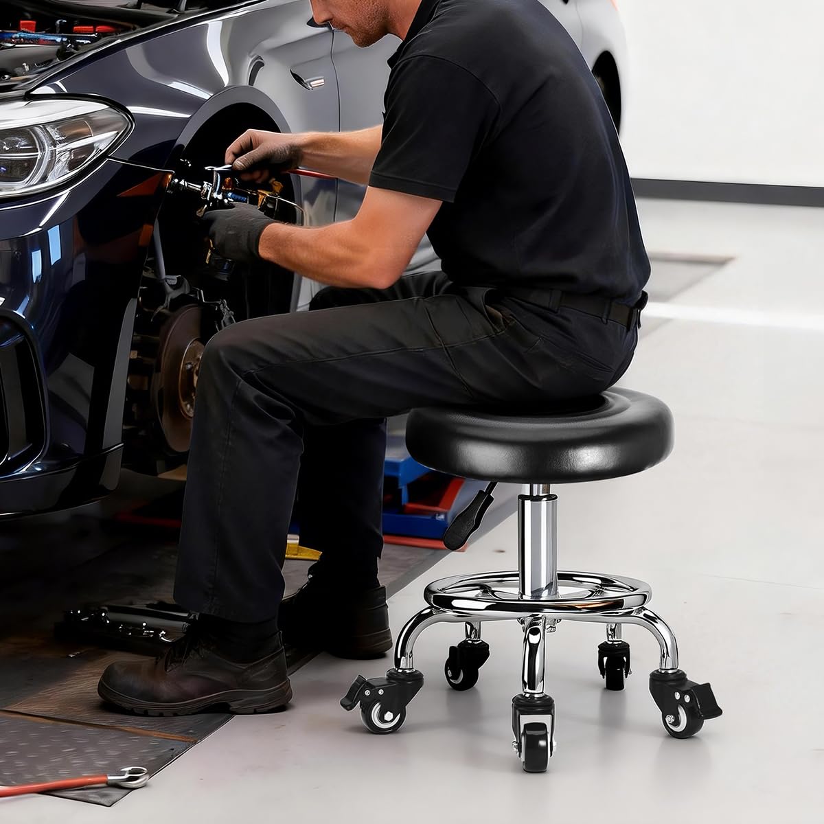 FLOLXNB stool in garage showing low seated access and hands-free mobility benefit