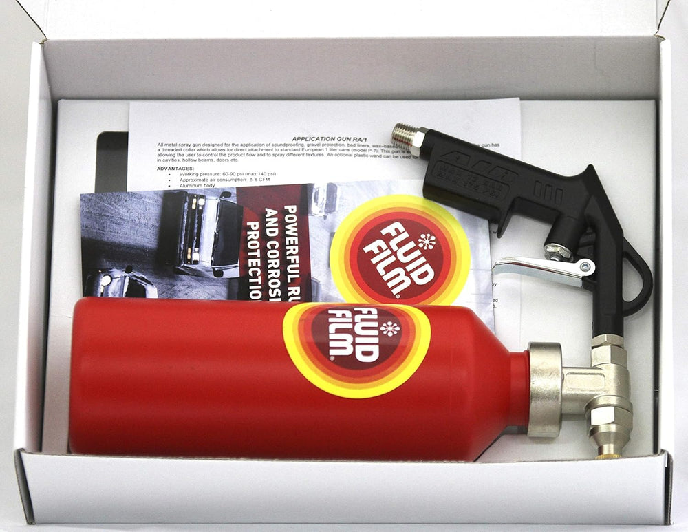 Fluid Film kit wands spraying into wheel well demonstrating reach and cavity coverage benefit