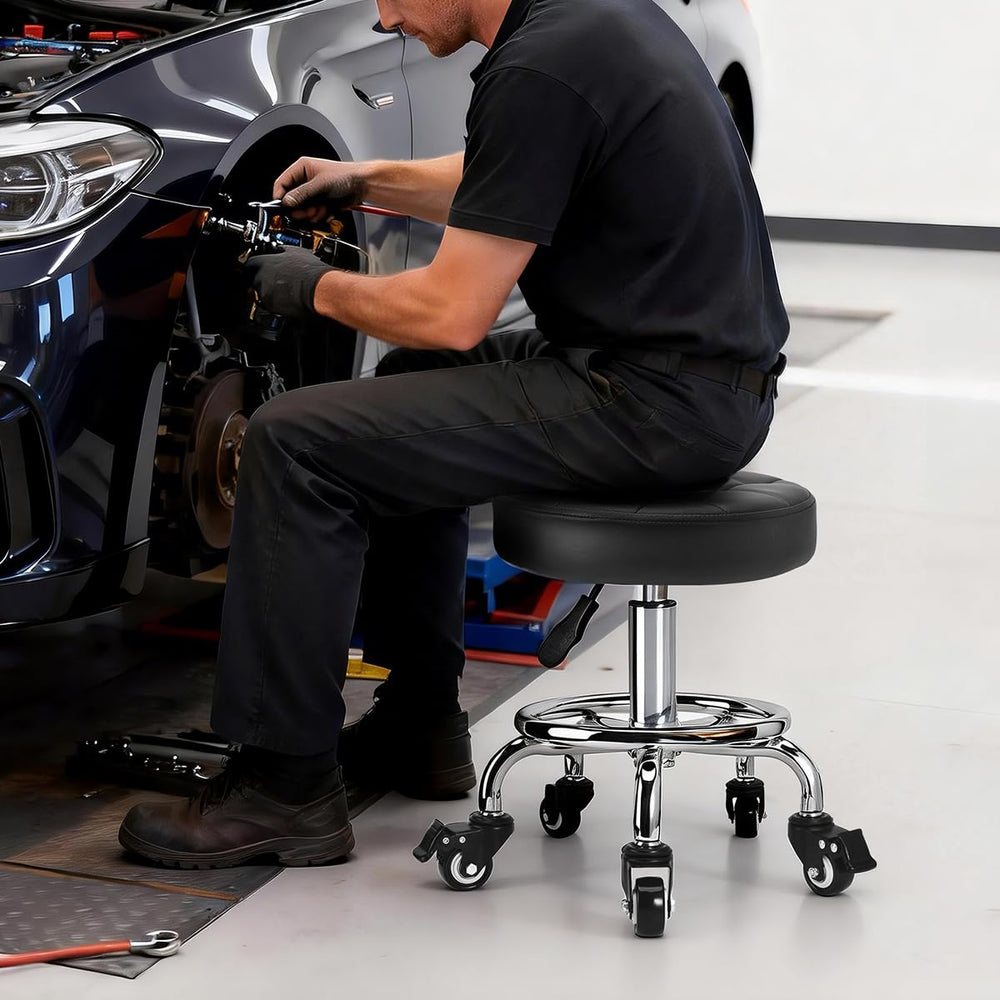 FLOLXNB stool used in garage showing mechanic-friendly low seating advantage
