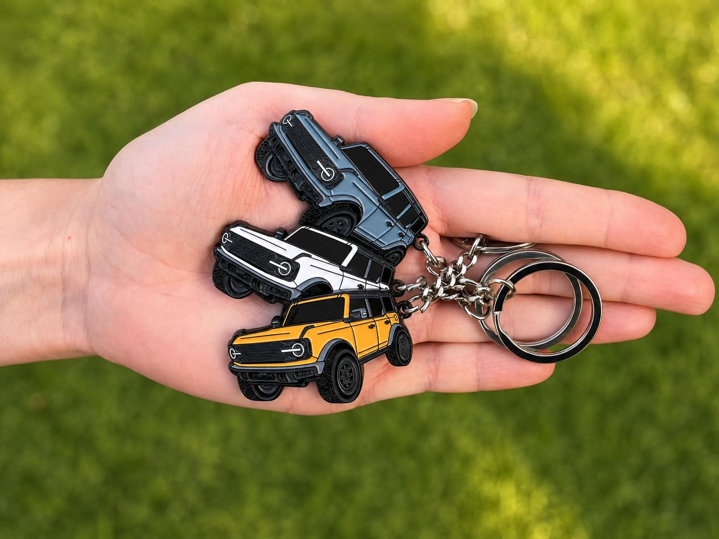 FOUR WHEEL BEAST keychain hanging on vehicle dashboard for styled accessory look