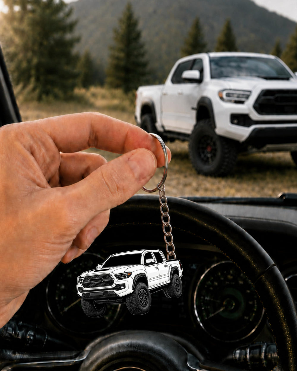 FOUR WHEEL BEAST keychain beside Tacoma fob illustrating accessory compatibility
