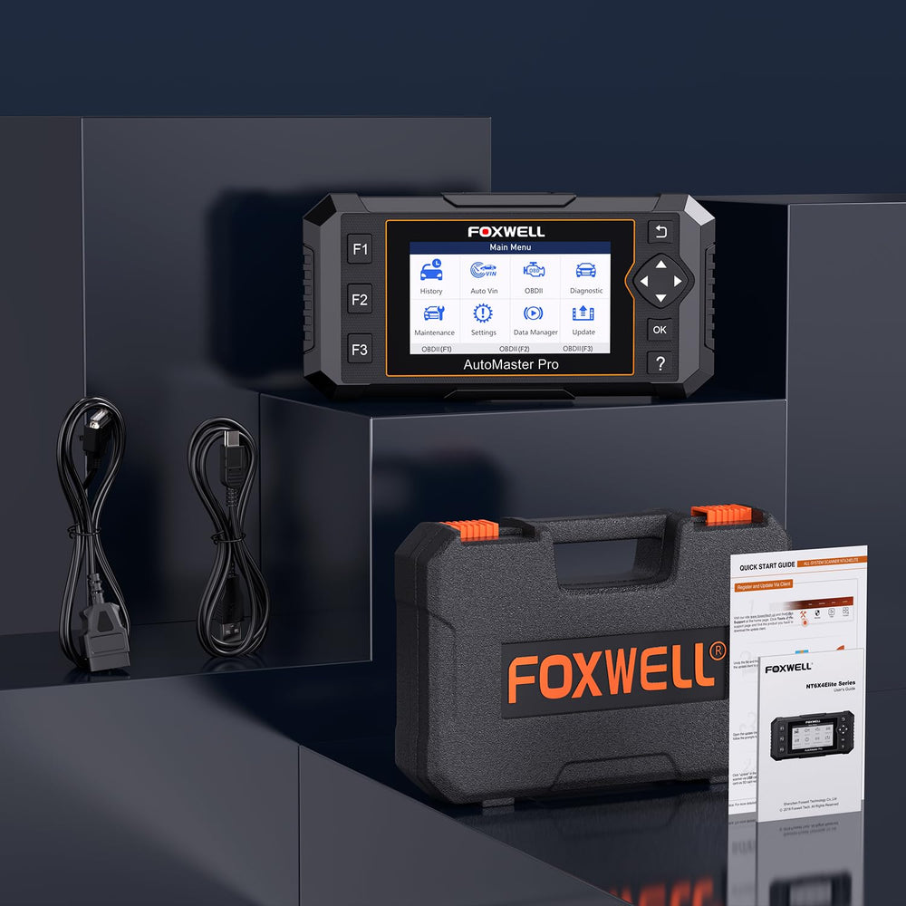 FOXWELL NT614 held in hand for size comparison, compact tool that fits workshop