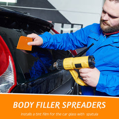 Frienda spreader applying putty on car panel for smooth even application