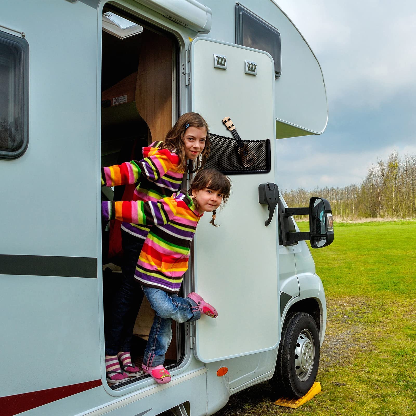 Frienda installed in a vehicle cabin during road trip for tidy storage