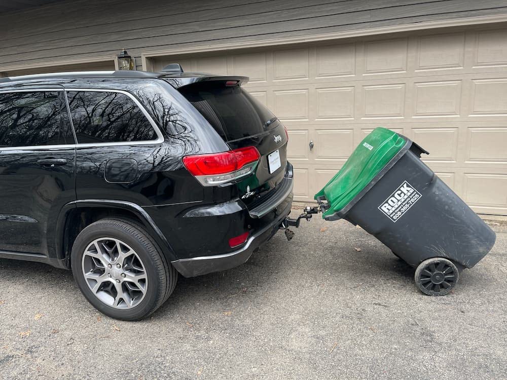 Garbage Commander installed on tractor hauling debris demonstrating real-world use
