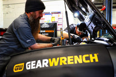 GEARWRENCH fender cover in use under hood protecting paint while holding tools and resisting oil