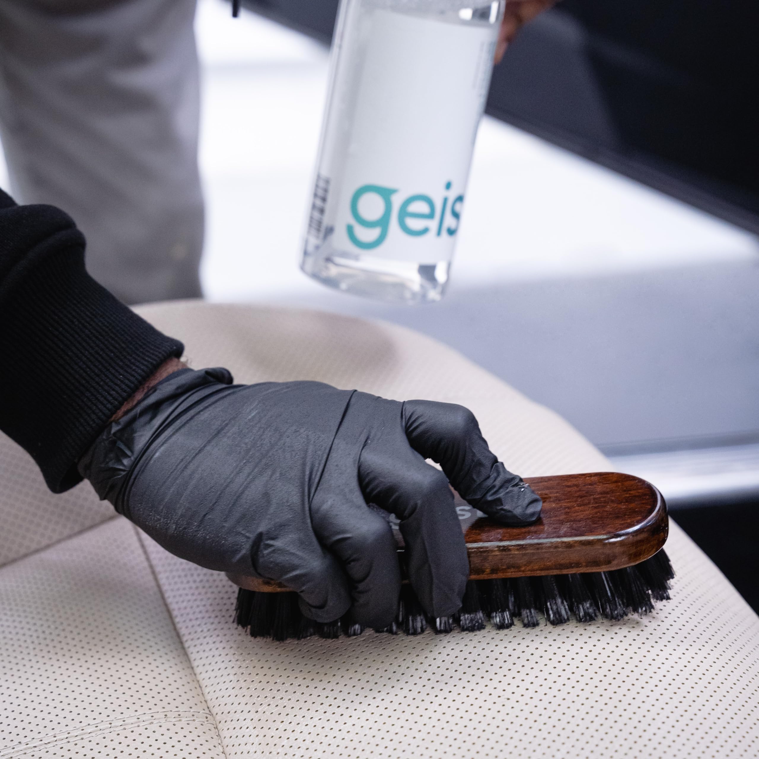 Geist bottle in hand for scale, indicating convenient 500 ml portability