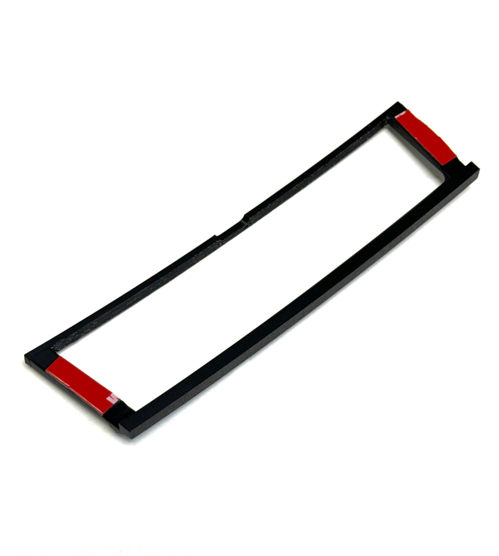 Generic bezel held by hand showing compact size and easy installation benefit