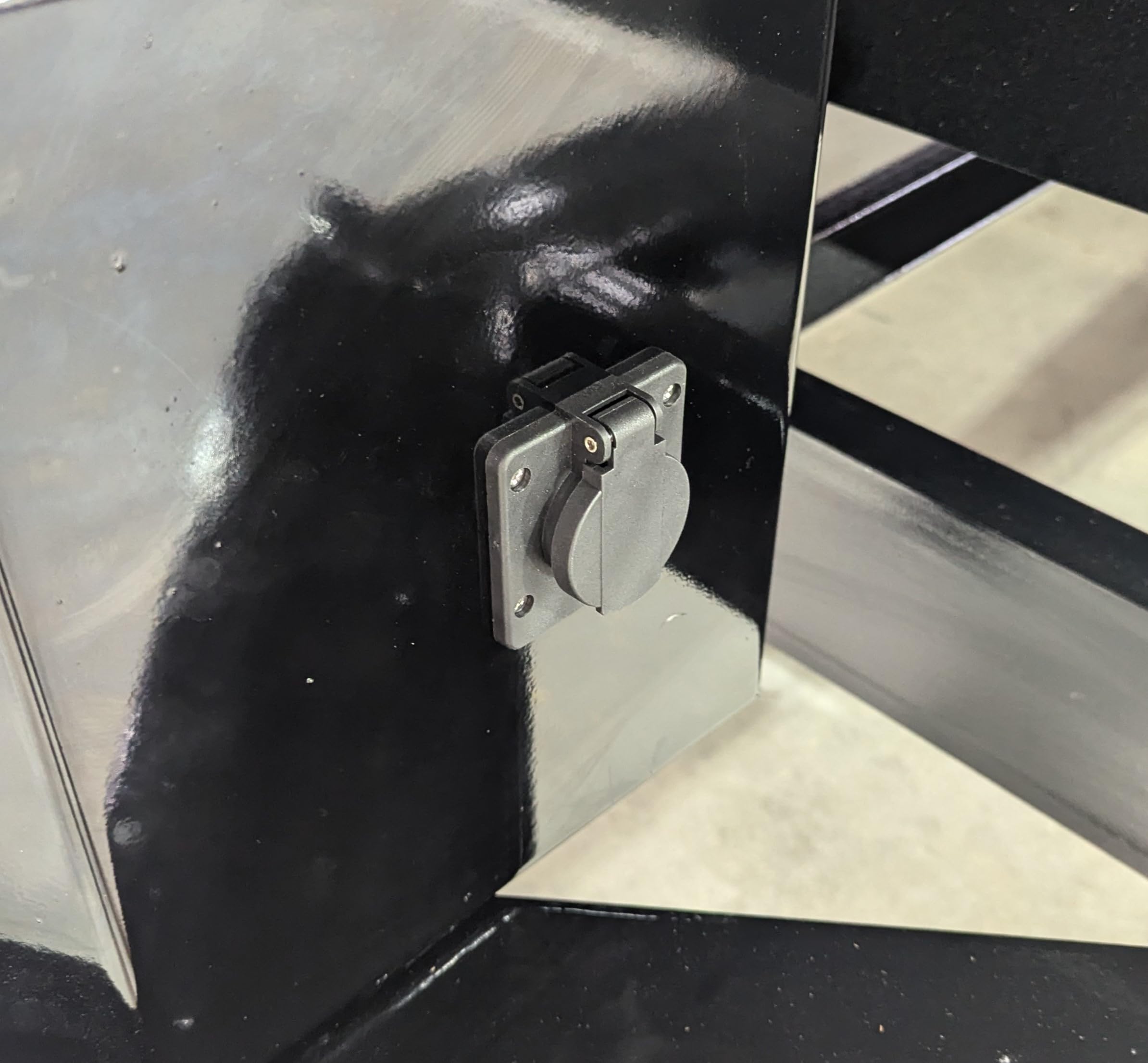 Generic hand holding unit for scale showing compact size and space-saving benefit