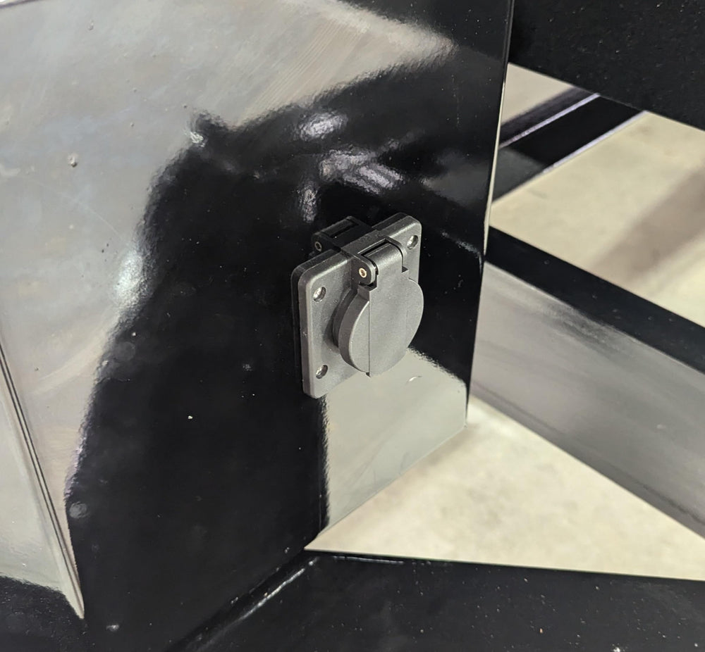 Generic hand holding unit for scale showing compact size and space-saving benefit