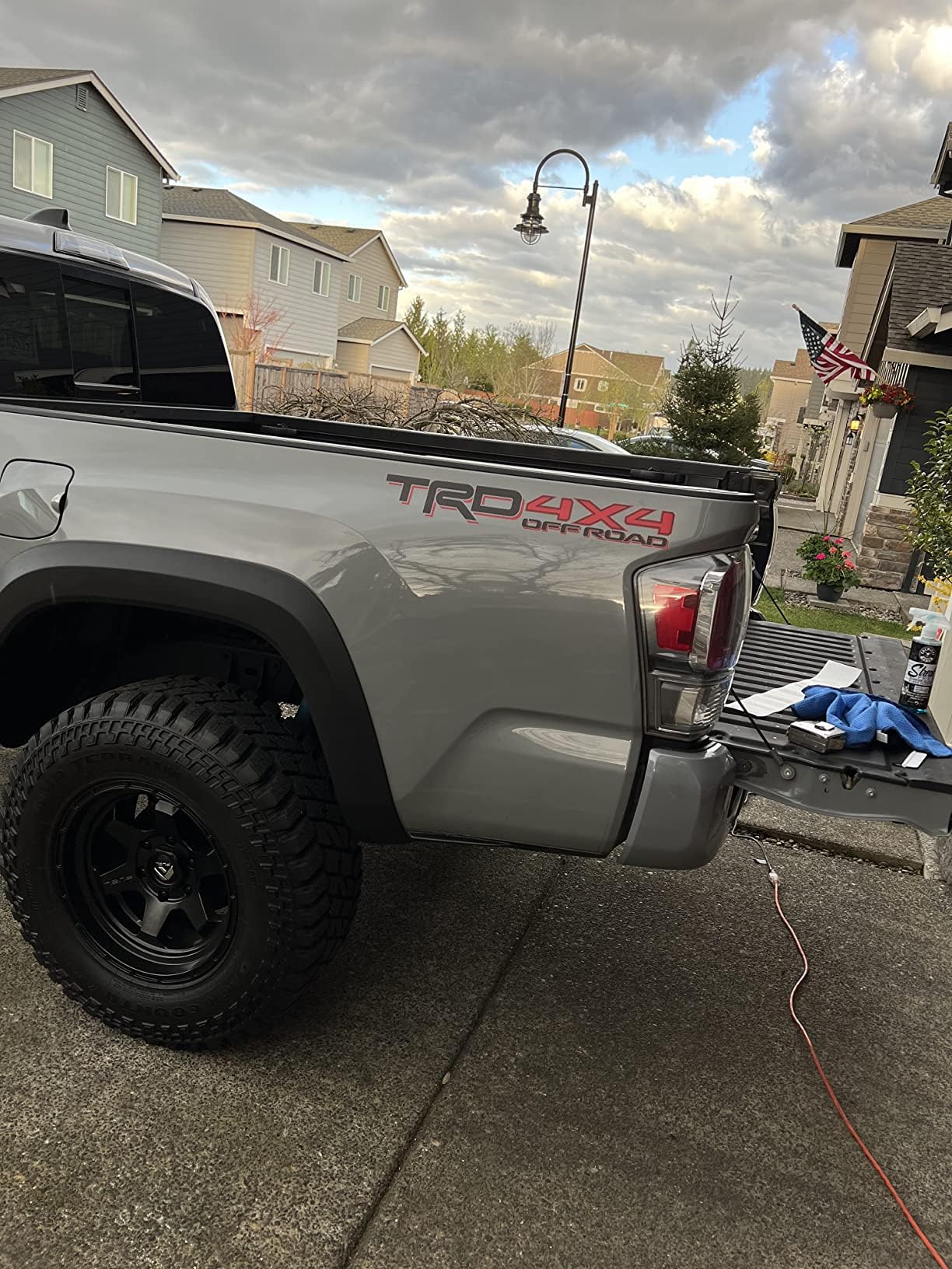 GO-GO.GROUP decal installed on pickup bedside demonstrating seamless paint match