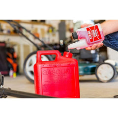 Gold Eagle being added to a lawnmower tank for improved starting after storage