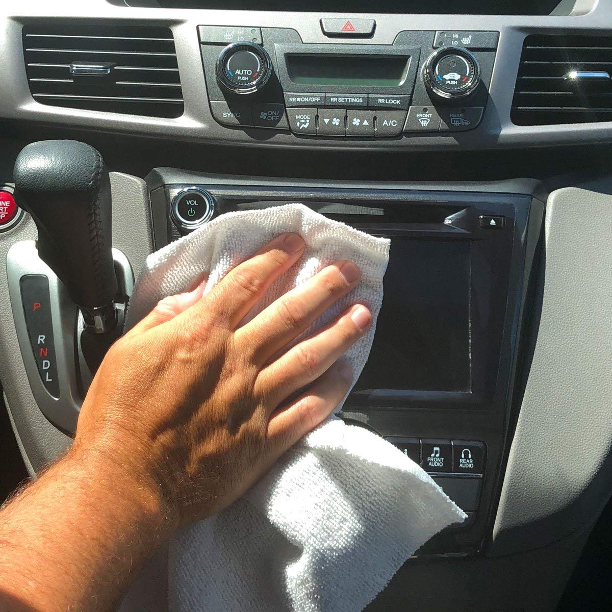 GrabaRag towel wiping kitchen counter leaving streak-free, clean surface