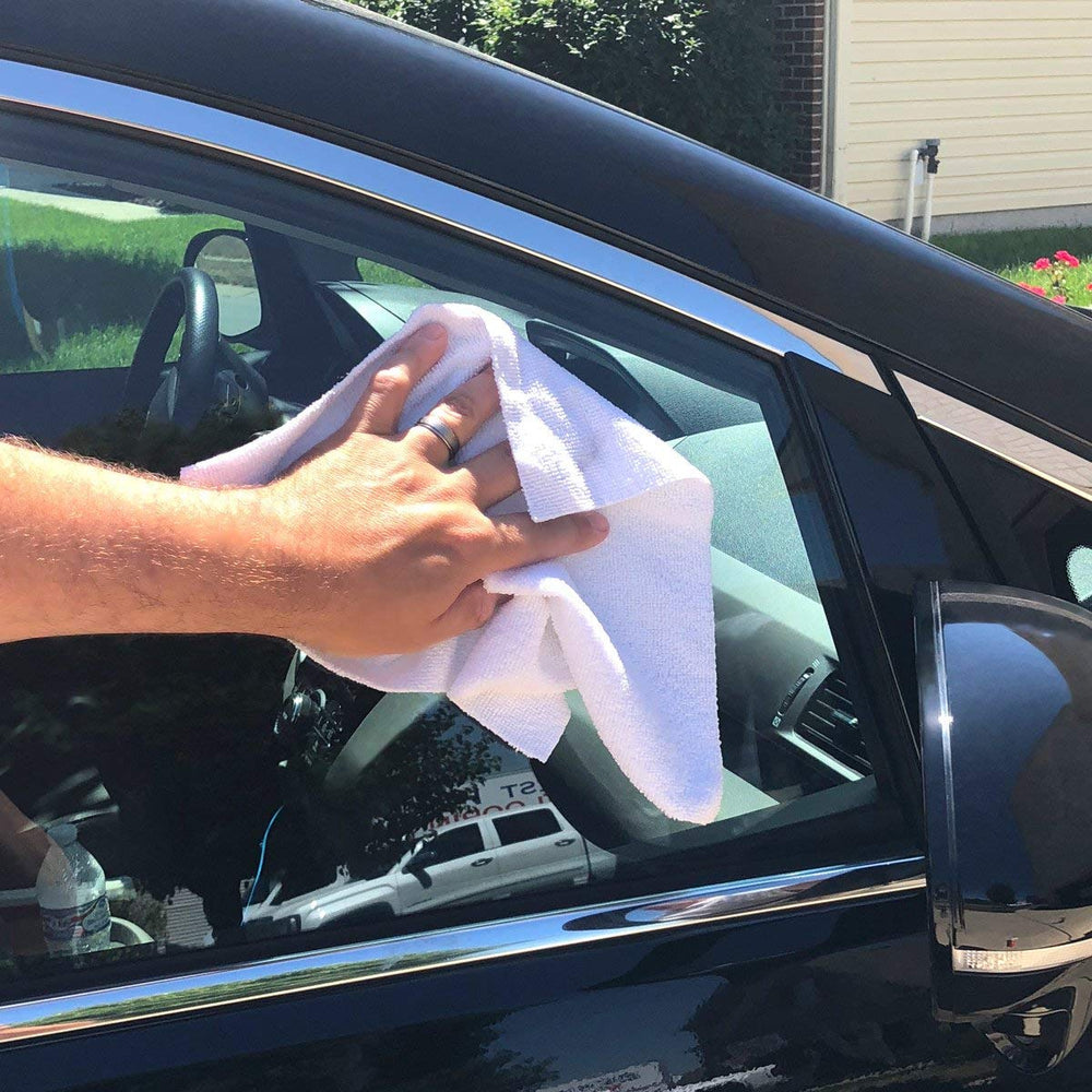 GrabaRag cloth held in hand to show 11.7x12.3-inch size and easy handling
