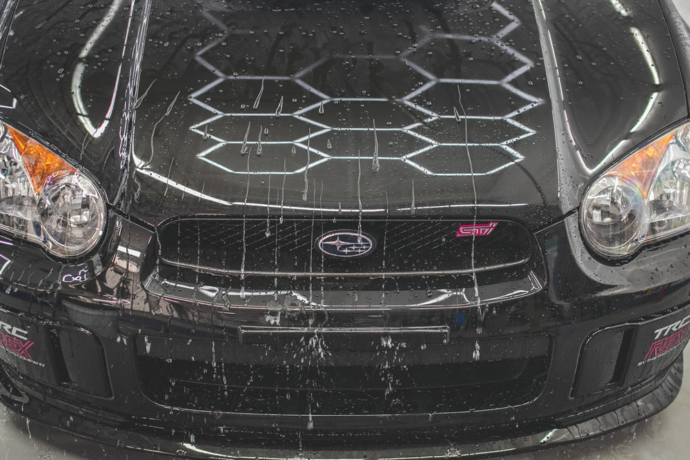 Gtechniq EXO water beading on car hood demonstrating fast runoff benefit