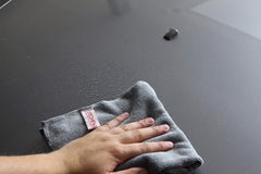 Gtechniq MF1 cloth wiping a gloss panel to demonstrate scratch-free finish
