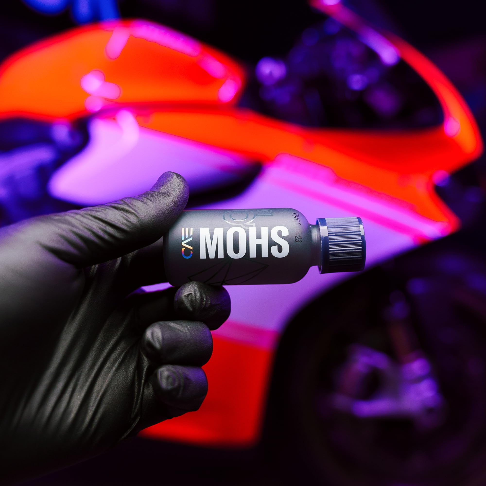 Gyeon MOHS EVO 30ml bottle next to coin showing compact size