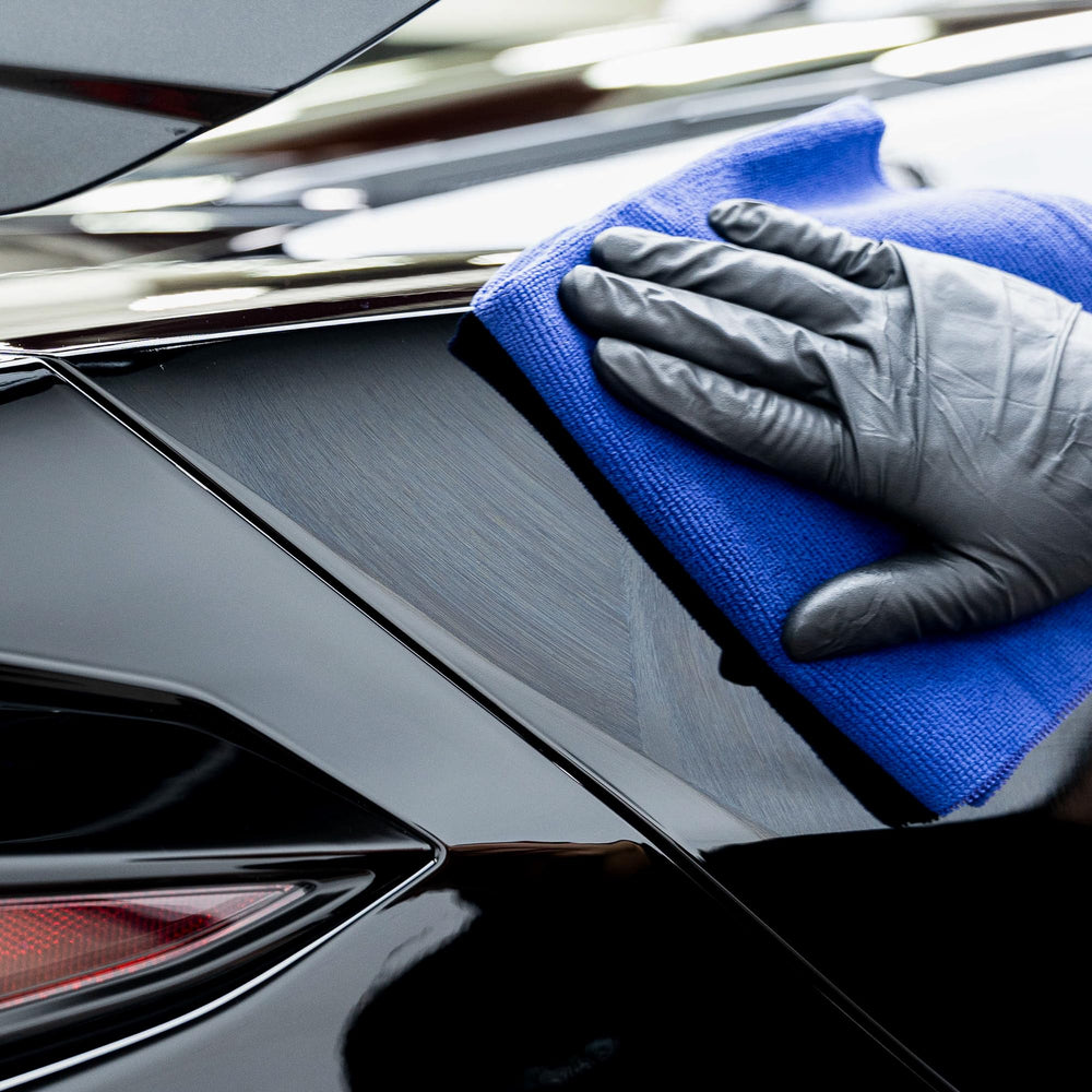 GYEON Pure water beading on coated hood demonstrating hydrophobic protection