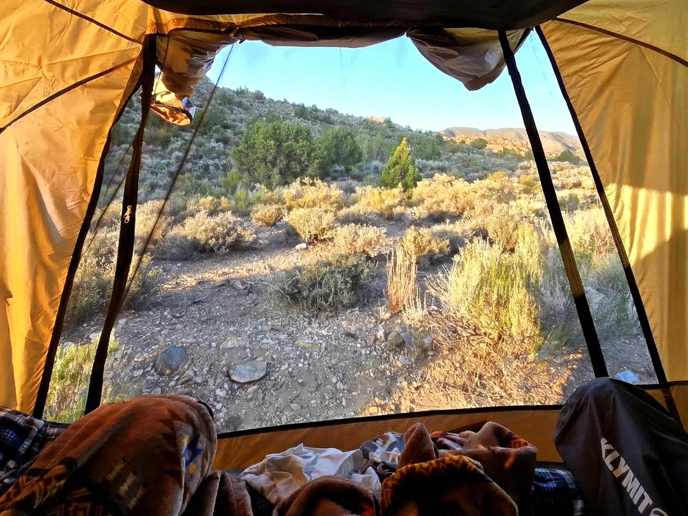 HASIKA tailgate tent providing lakeside shade for fishing comfort