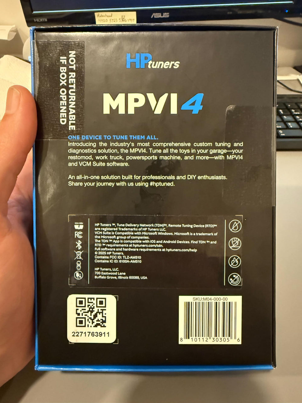 Generic Hinson MPVI4 plugged into vehicle OBD port demonstrating in-vehicle use