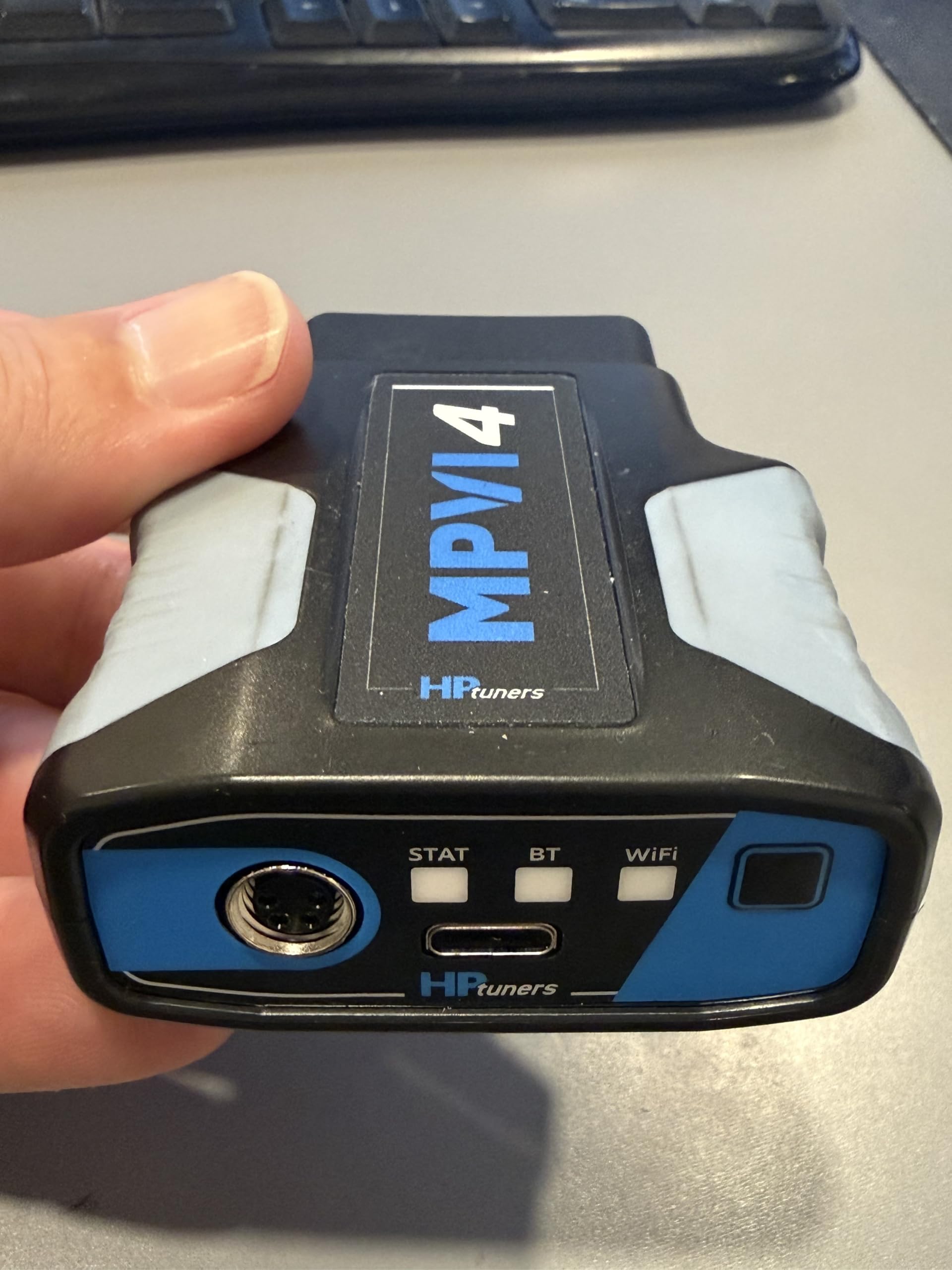 Generic Hinson MPVI4 held next to hand showing compact size and workshop portability
