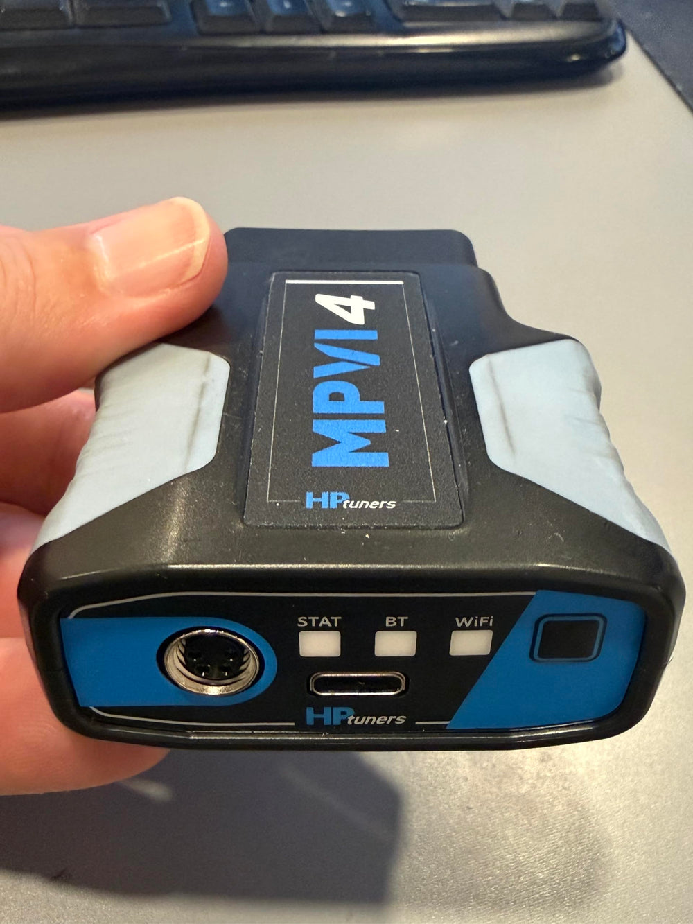 Generic Hinson MPVI4 held next to hand showing compact size and workshop portability