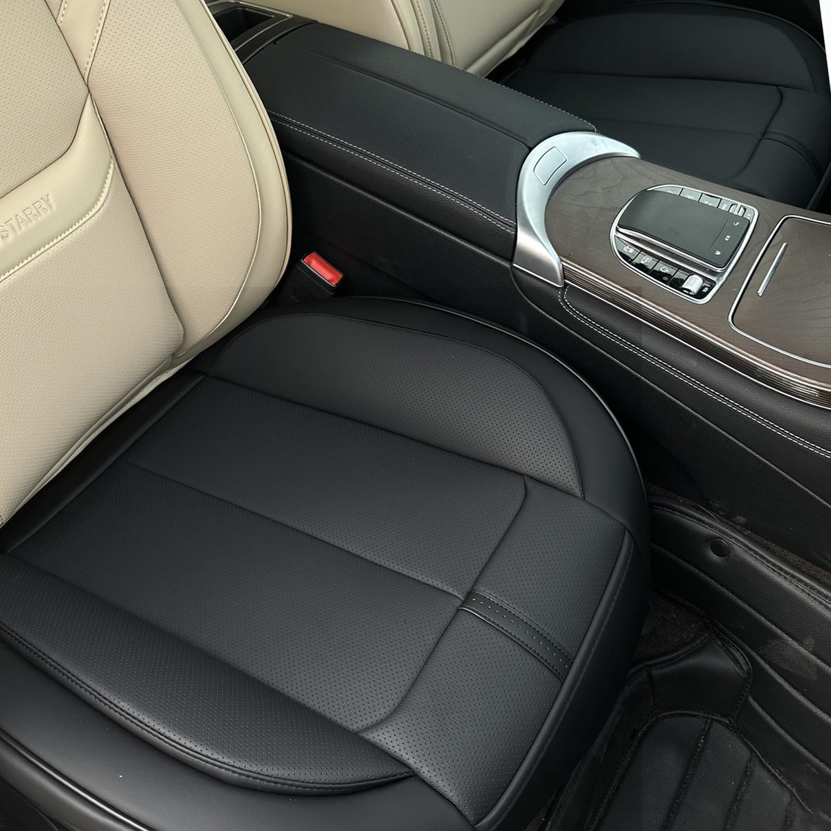 HOMOSTARRY packaging showing two black front seat bottom covers and included manual