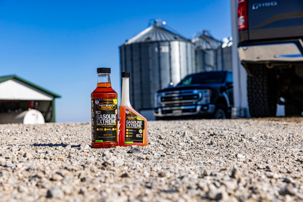 Hot Shot's Secret 32 oz bottle next to a measuring cup to show accurate sizing