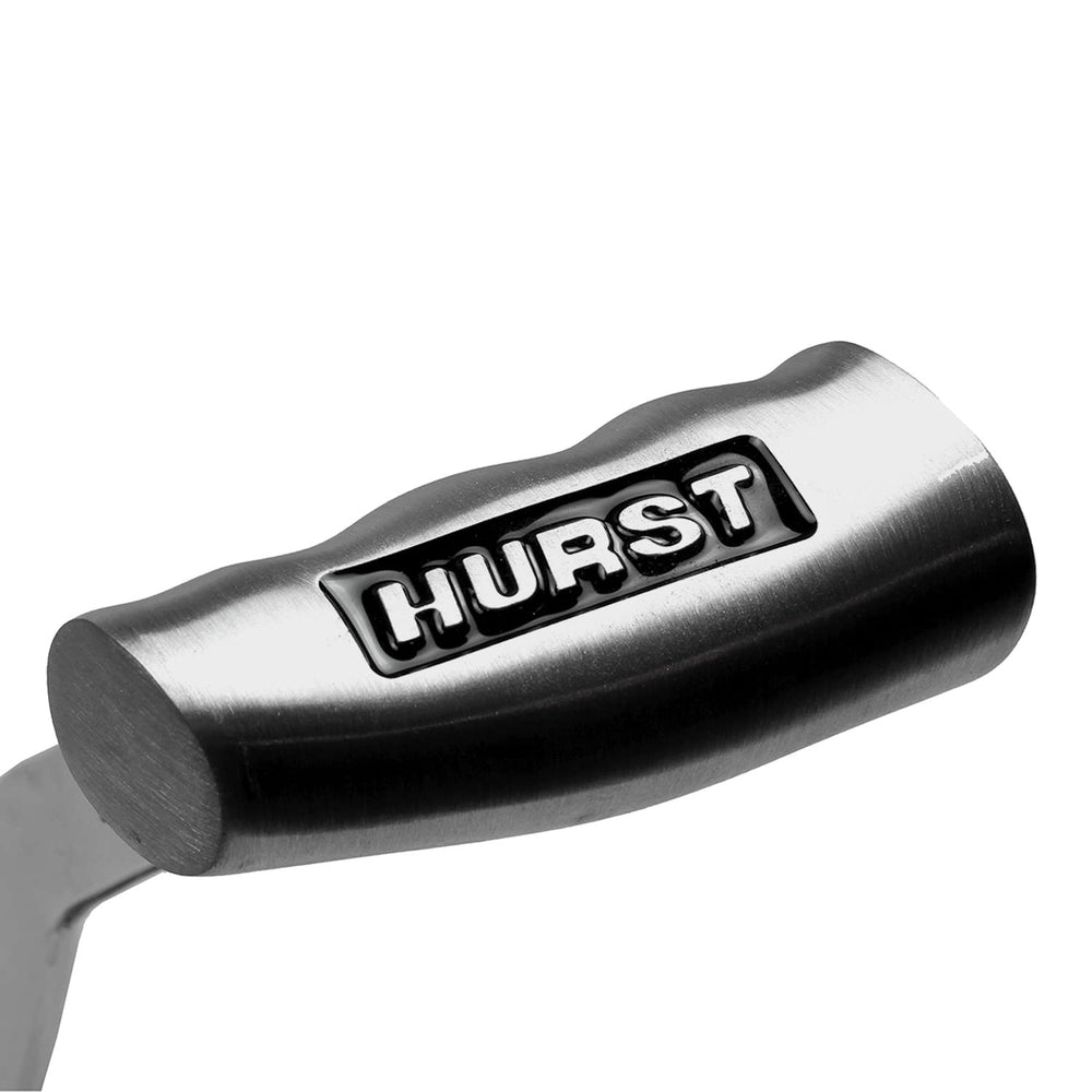 Hurst T-handle next to ruler for scale showing compact dimensions and fitment clarity