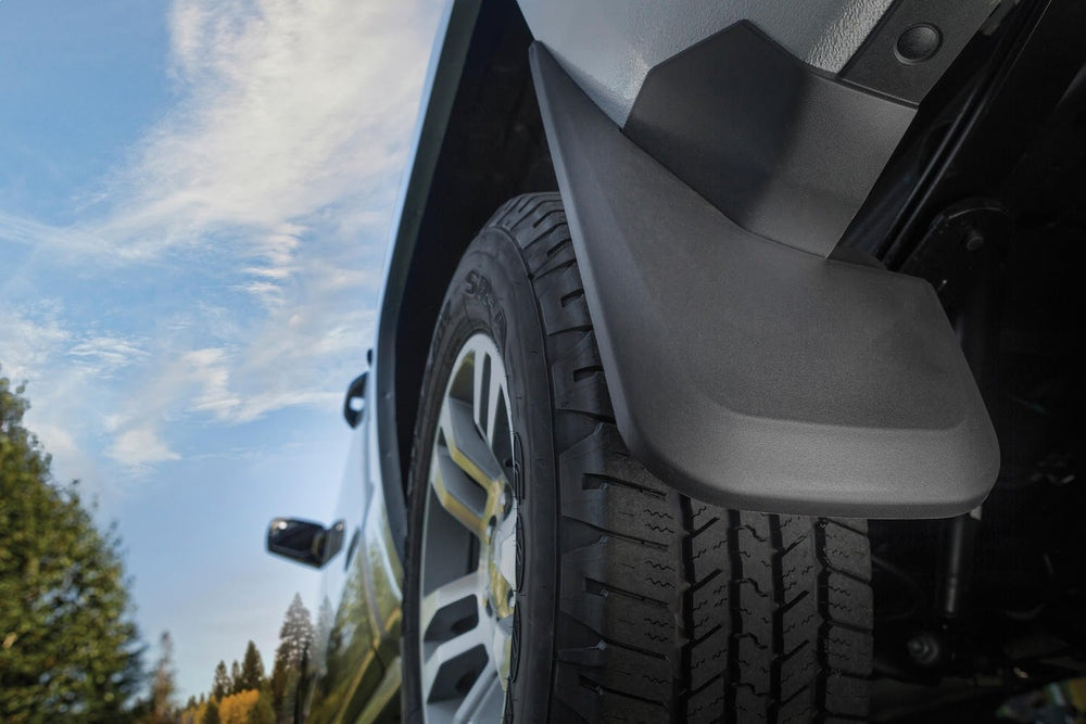 Husky Liners mud guards installed on Silverado repelling road spray and debris