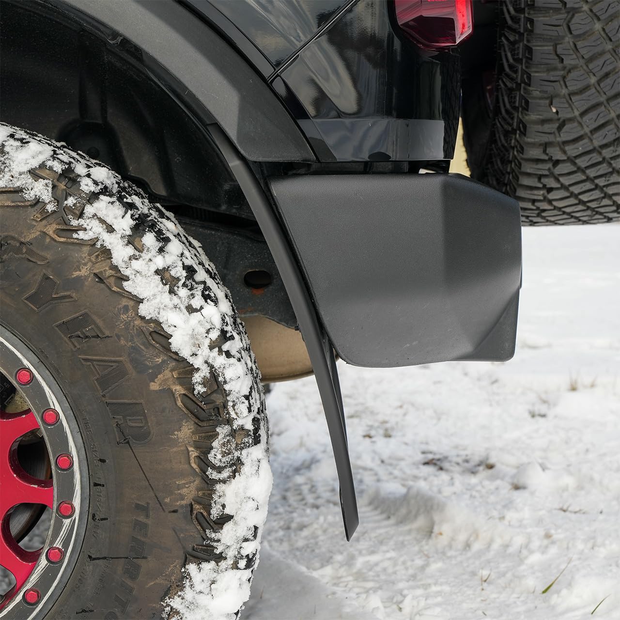 IAG Performance mud flap deflecting mud during off-road drive for protection