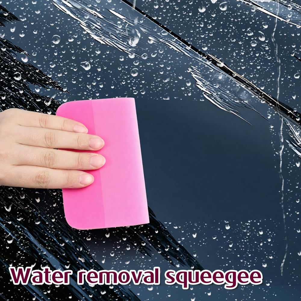 IANFAN applying squeegee to window tint to eliminate water and air pockets