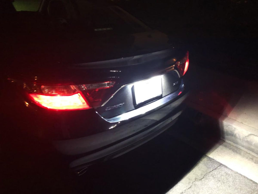 iJDMTOY installed on vehicle at night improving license plate legibility and rear visibility