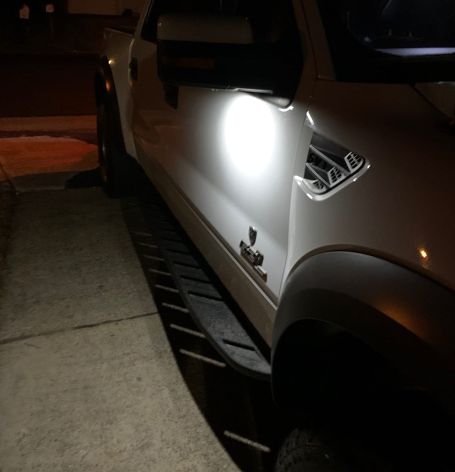 iJDMTOY installed under mirror illuminating ground for safer door entry