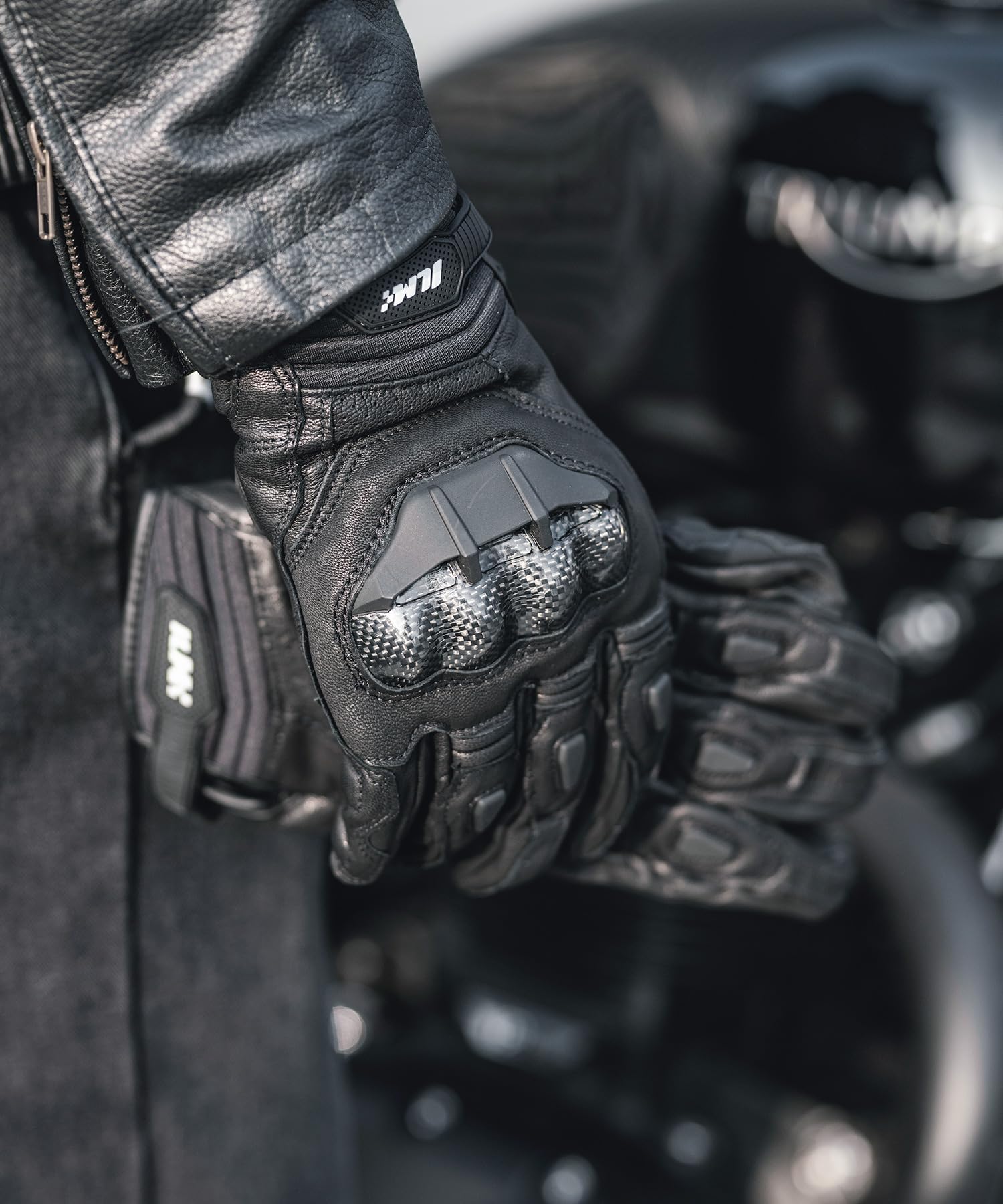 ILM glove on handlebar showing scale and secure ergonomic fit