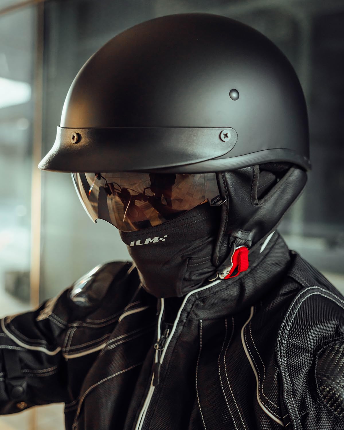 ILM helmet beside a ruler showing compact size and fit benefit