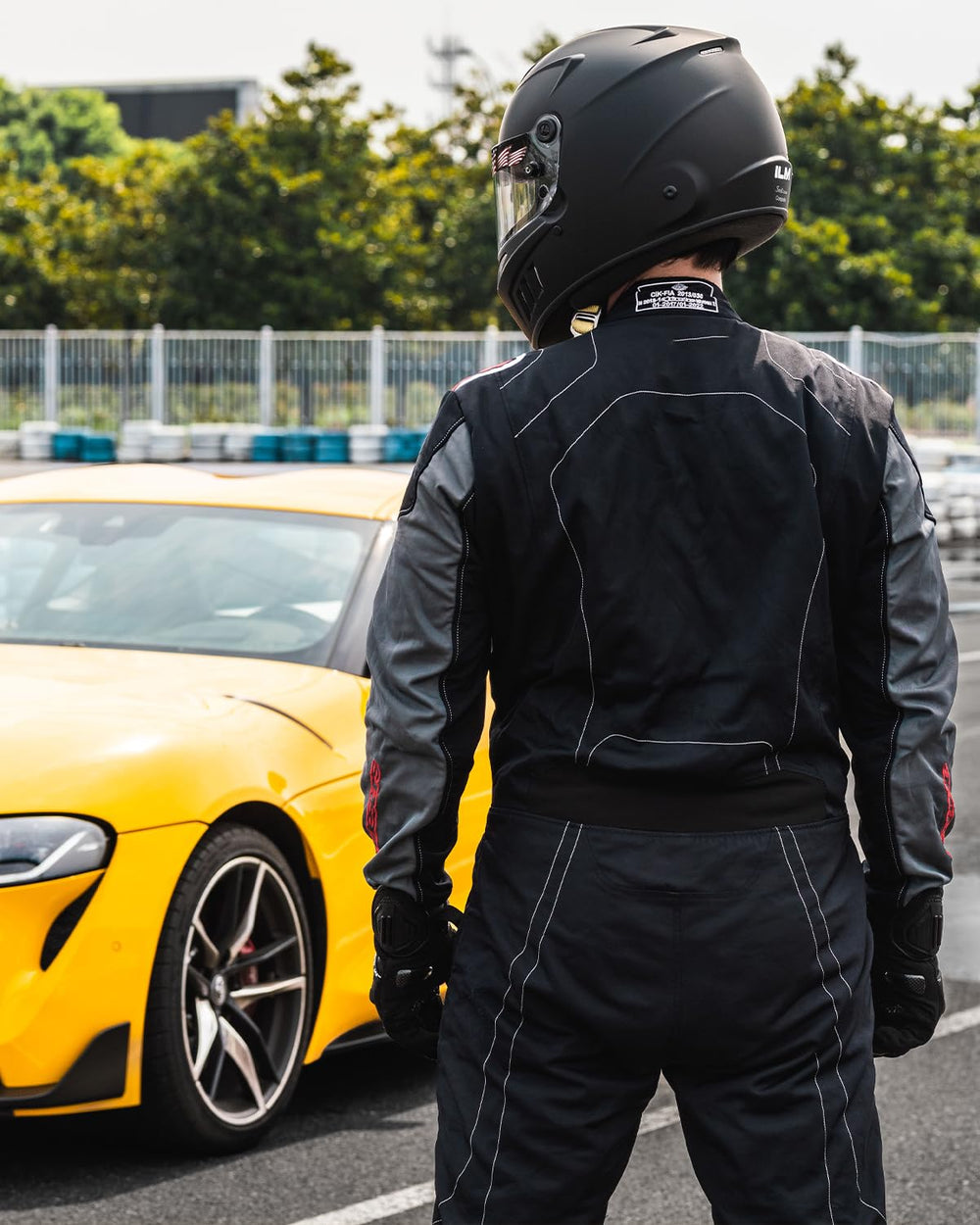 ILM helmet mounted in racing seat illustrating cockpit fit and driver compatibility