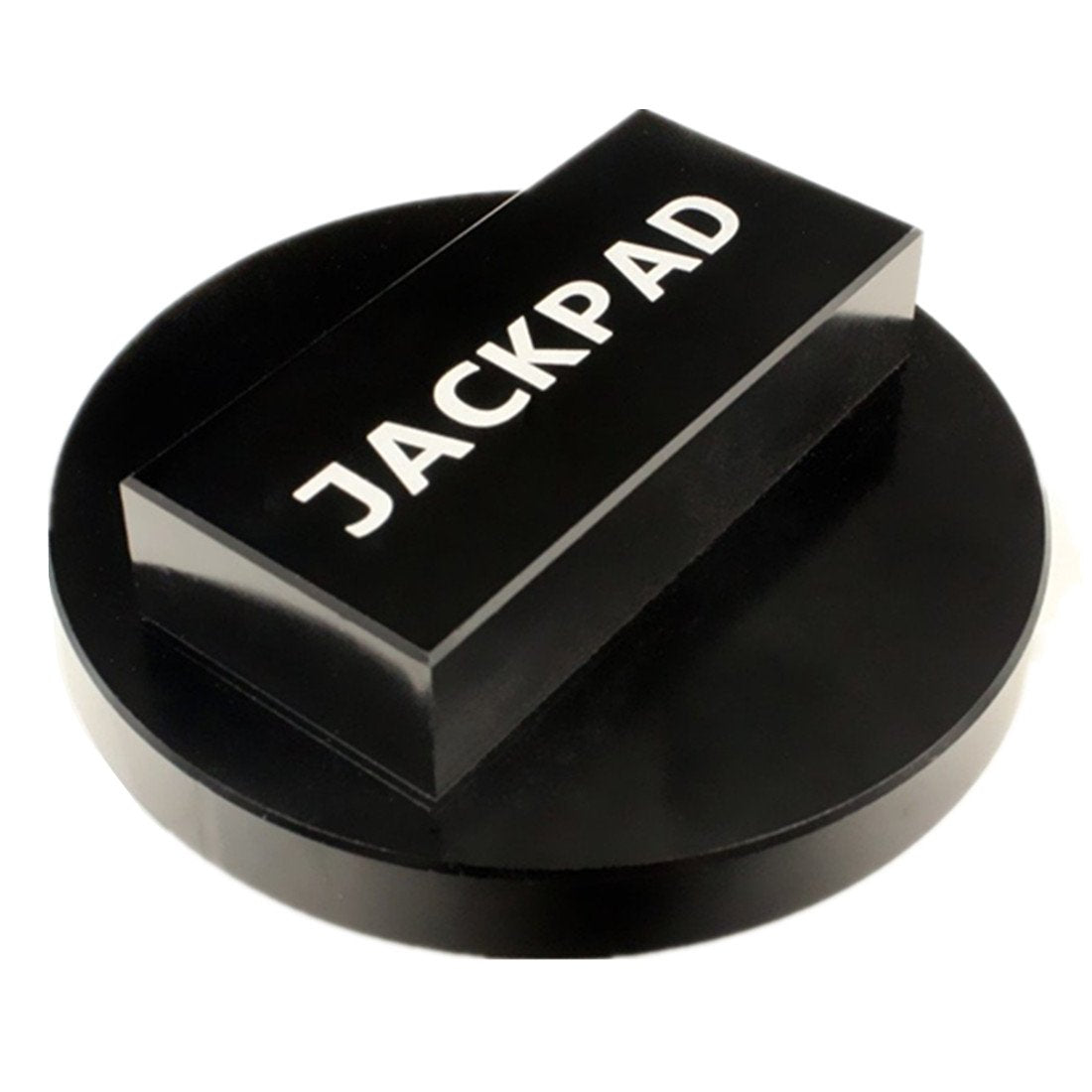 imUfer jack pad in a garage setting used during routine wheel maintenance