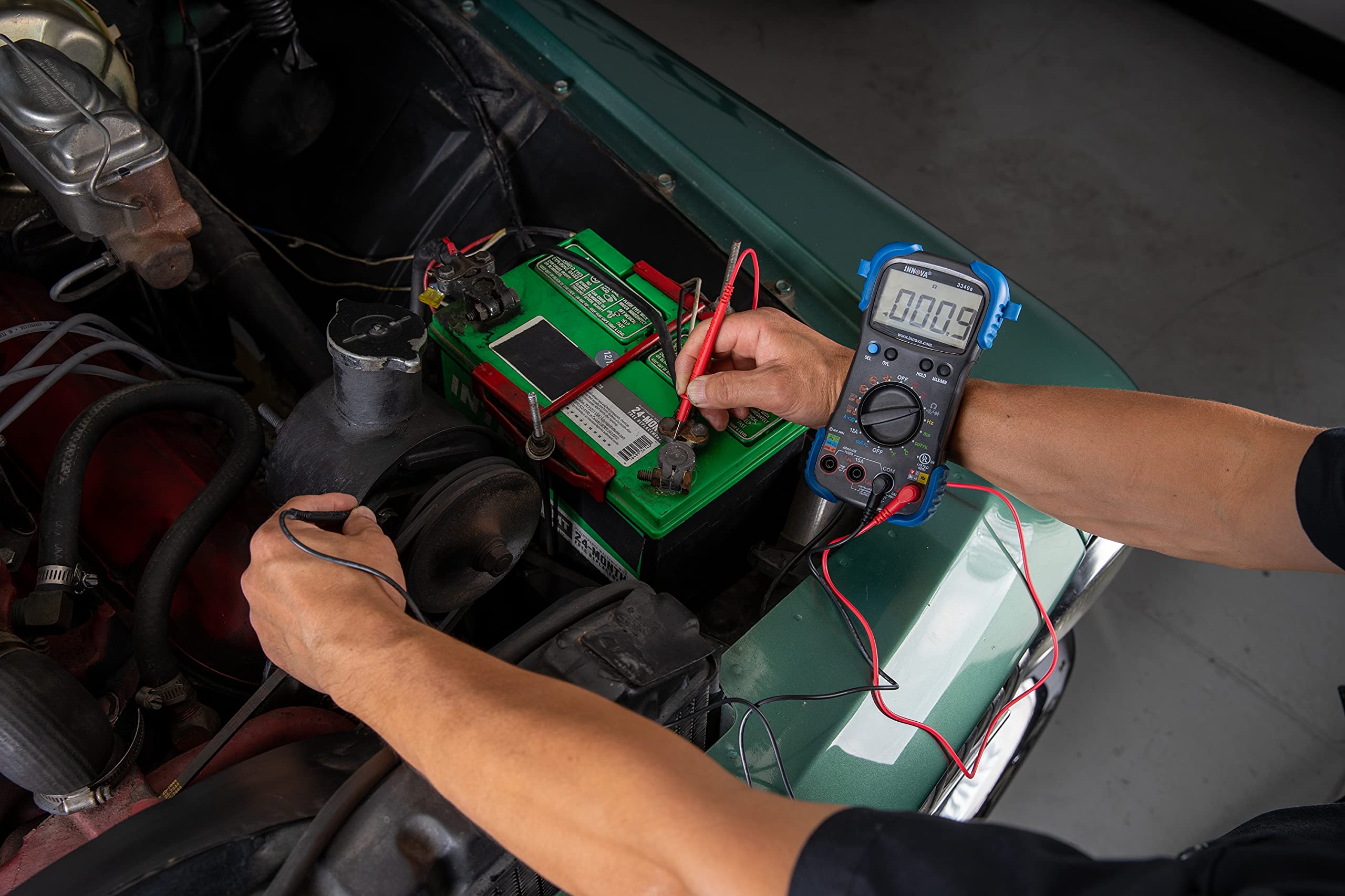 Innova 3340 being used in an engine bay to diagnose charging system