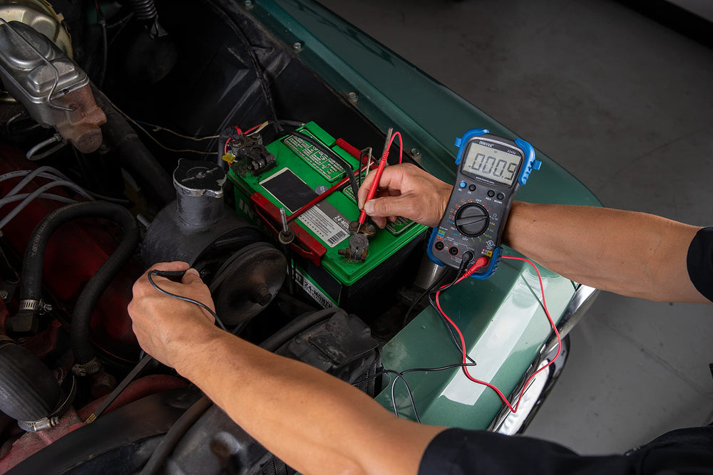 Innova 3340 being used in an engine bay to diagnose charging system