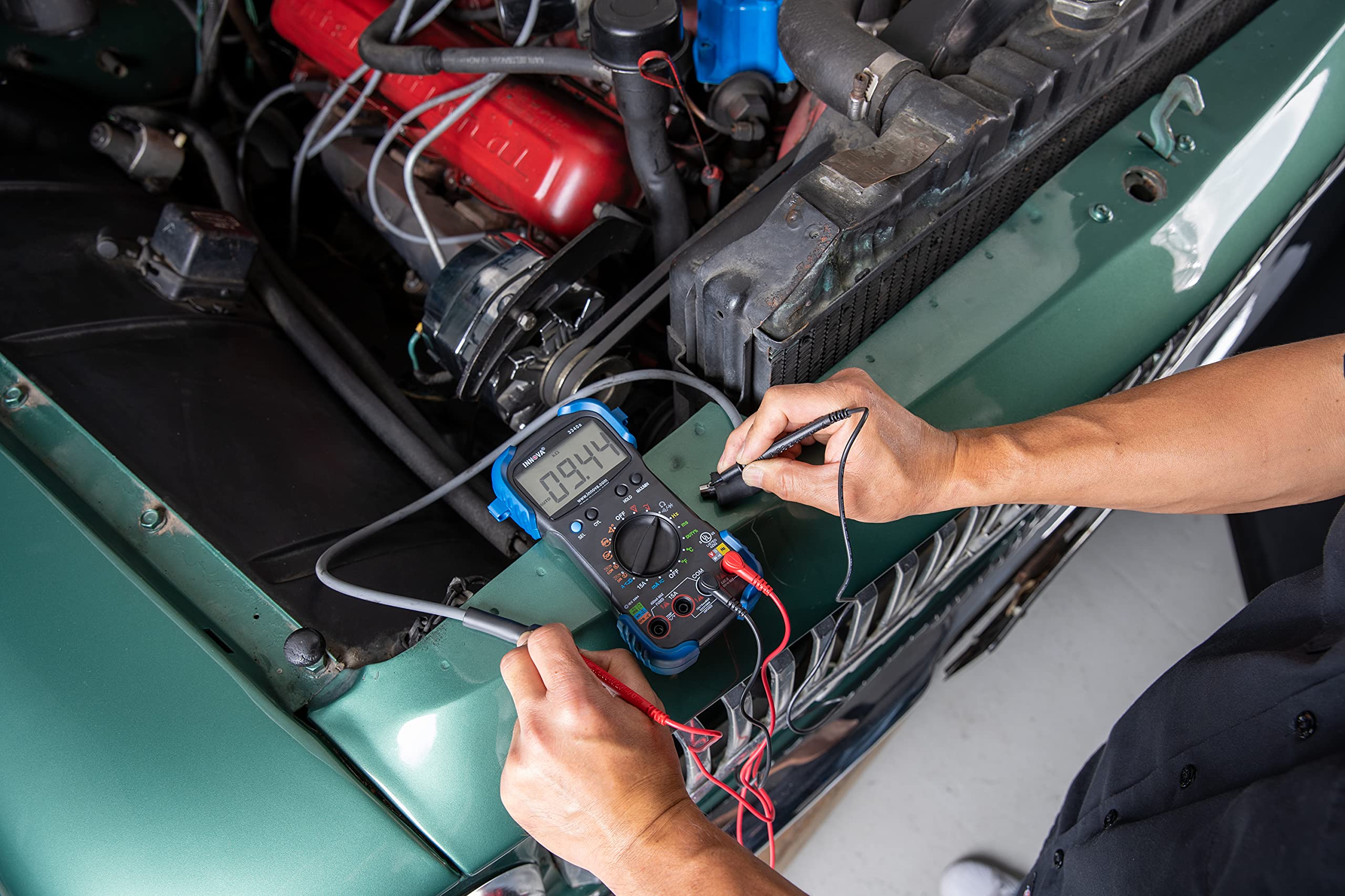 Innova 3340 test leads in holders for hands-free engine testing