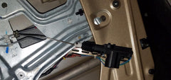 InstallGear actuator installed inside car door illustrating secure fit and quiet operation