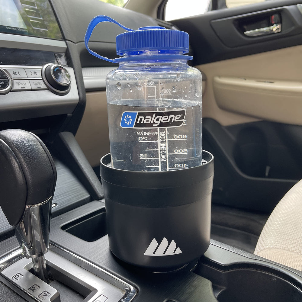 Integral expander in car cup holder on road trip for spill prevention